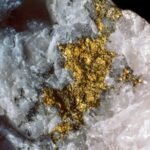 A bit of gold nestled inside a quartz block.